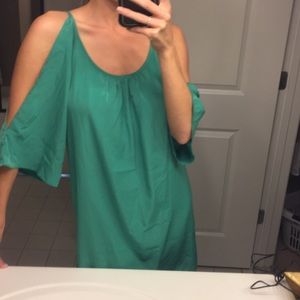 Green pastel dress, open shoulders.